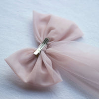 The back of our large dusty pink tulle bow, showing the alligator clip.