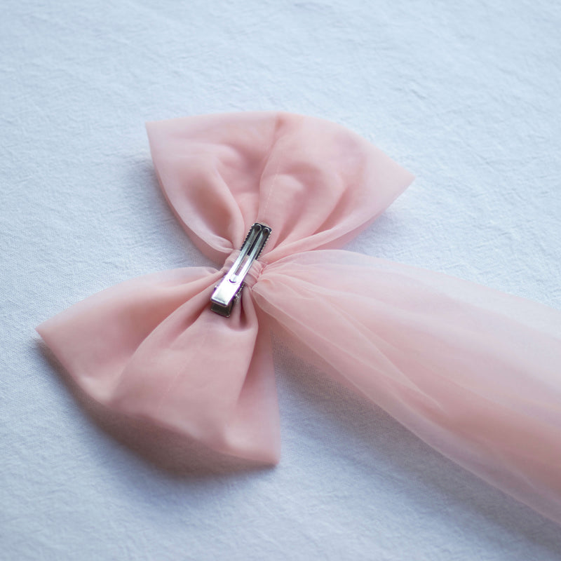 Back of our large tulle bow in peachy blush.
