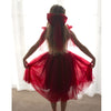 Rosie wine flower girl dress is shown from behind on a young girl. A beautiful Christmas dress, along with matching large tulle bow.