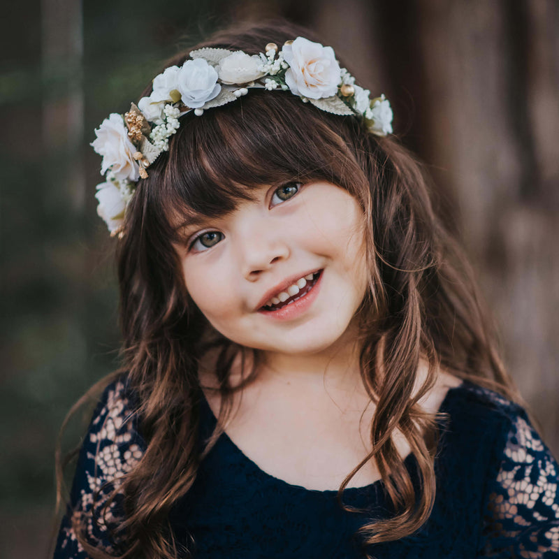 Sage ivory girls flower crown worn by a young girl. She also wears our Willow flower girl dress.
