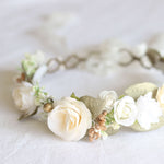 Sage ivory girls flower crown shown close up. Showing ivory floral details and gold accents. A beautiful wedding flower crown for flower girls or brides.