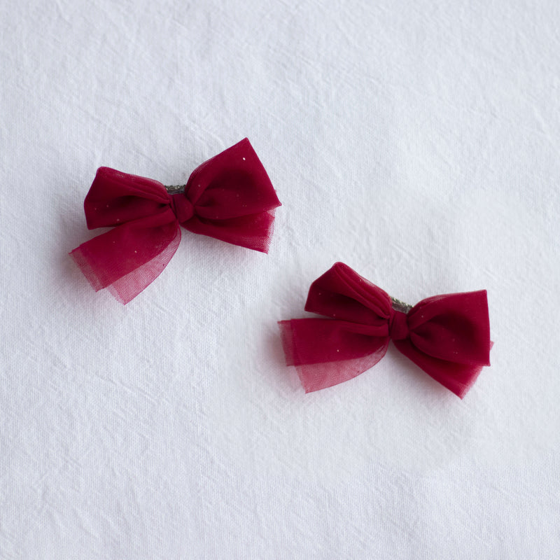 Crimson tulle pigtail Christmas bows.