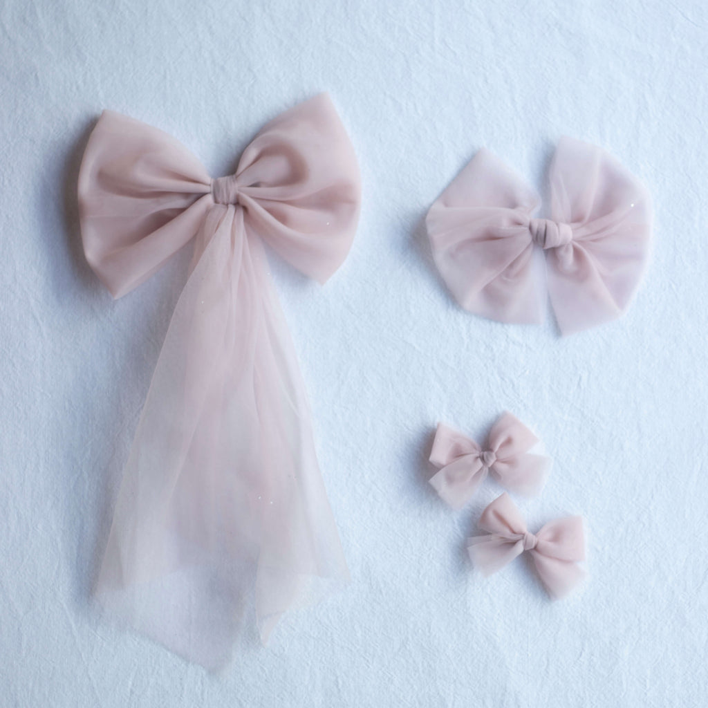 Dusty pink tulle bows in three different styles.