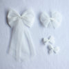 Girls ivory tulle bows. Our large tulle bow clip, medium tulle bow clip and small pigtail bow clips.
