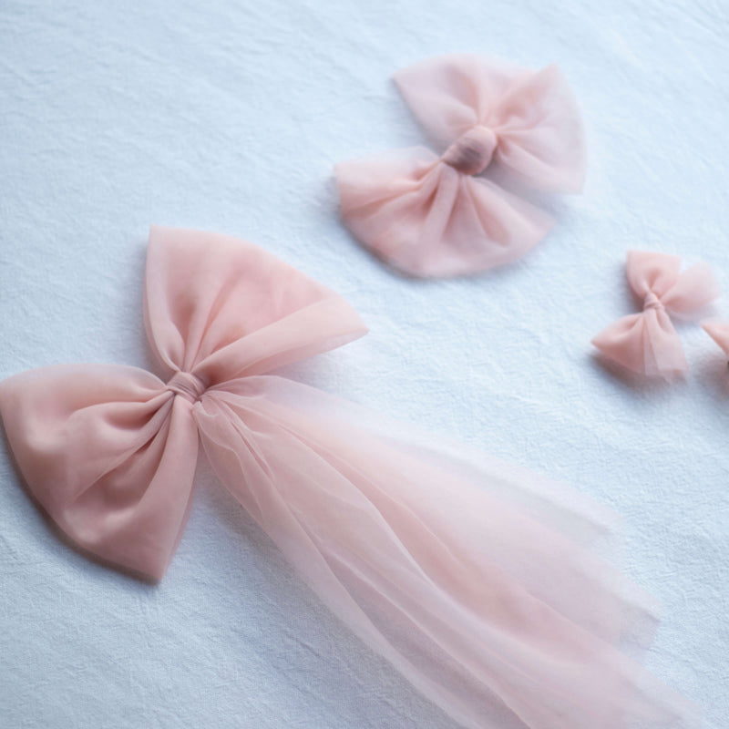 Peach tulle bows in three styles. To match our party dresses and flower girl dresses in peachy blush.