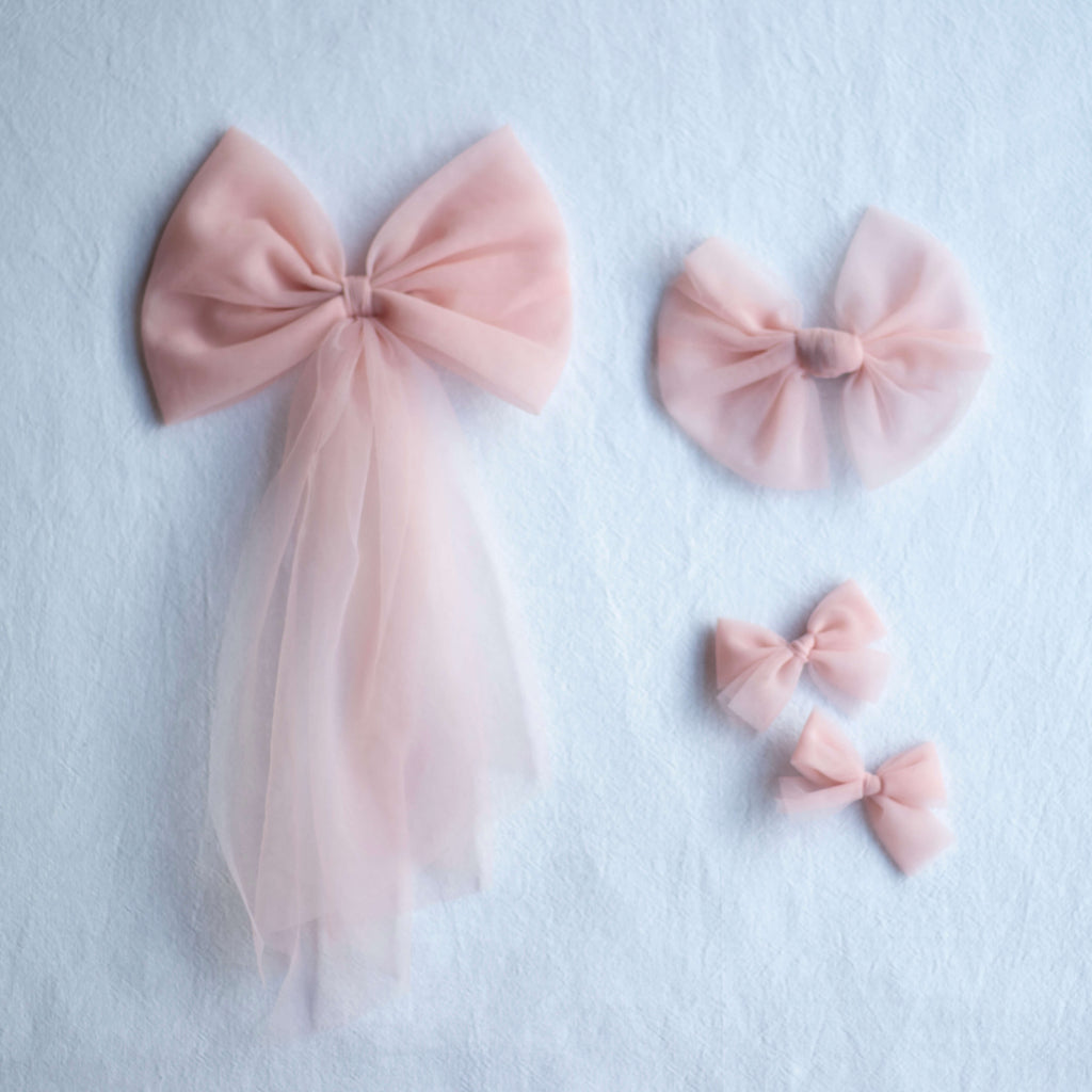 Tulle bows in peachy blush, in three different styles.