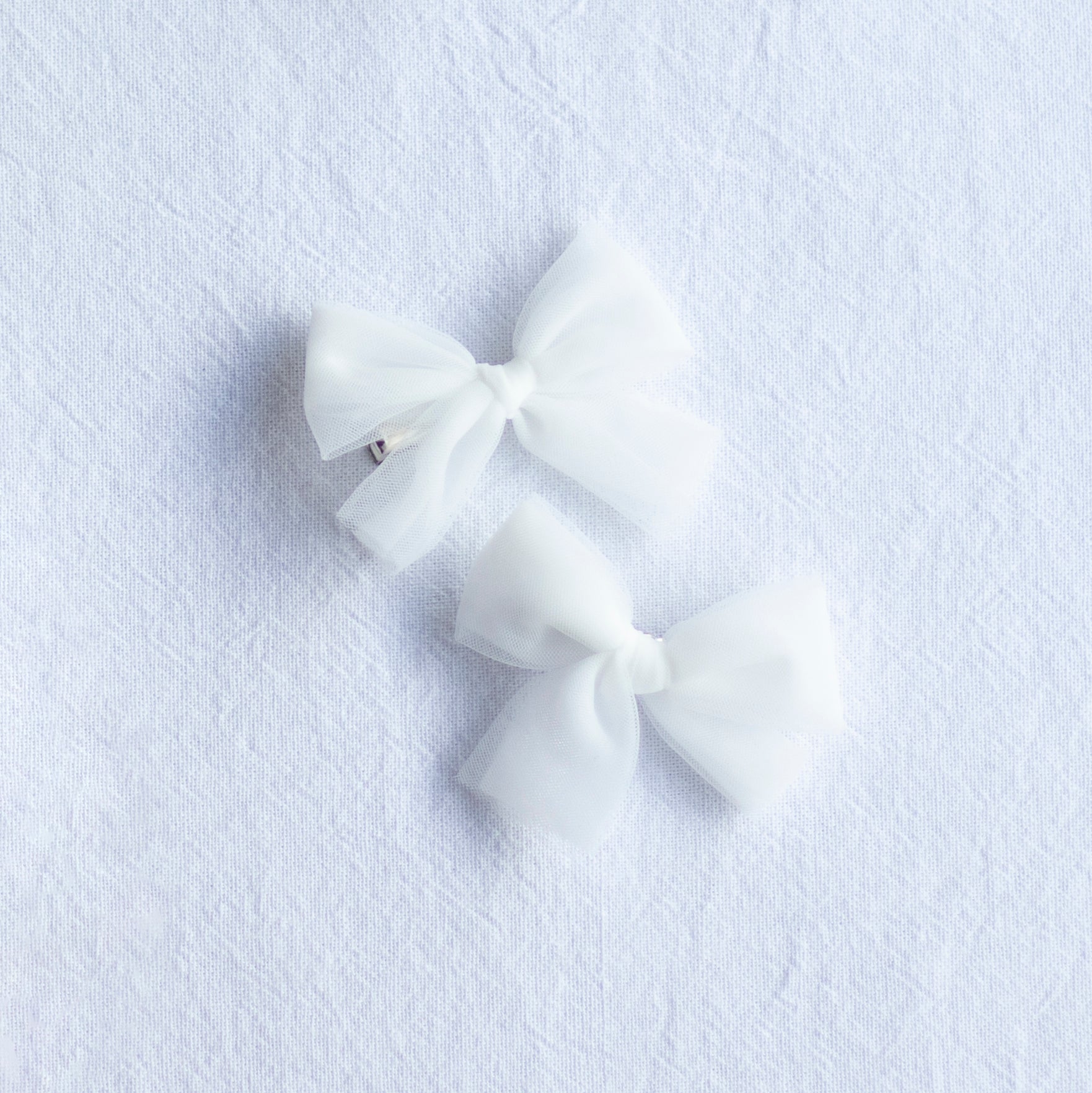 Small tulle pigtail bows, set of two, in soft ivory tulle.
